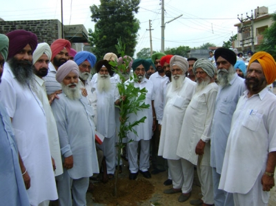Jassi and his father at Latala initiating Tree Plantation programme to improve the environment