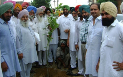 Jassi and his father at Latala initiating Tree Plantation programme to improve the environment 